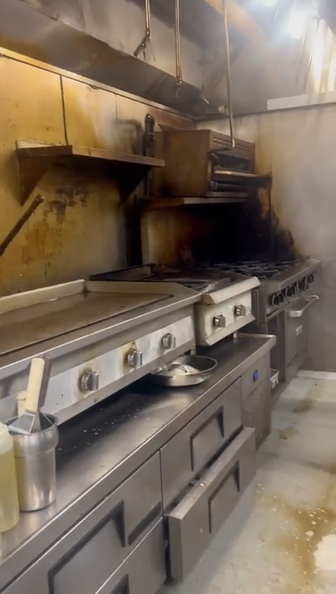 Commercial kitchen with buildup visible around the cooking area